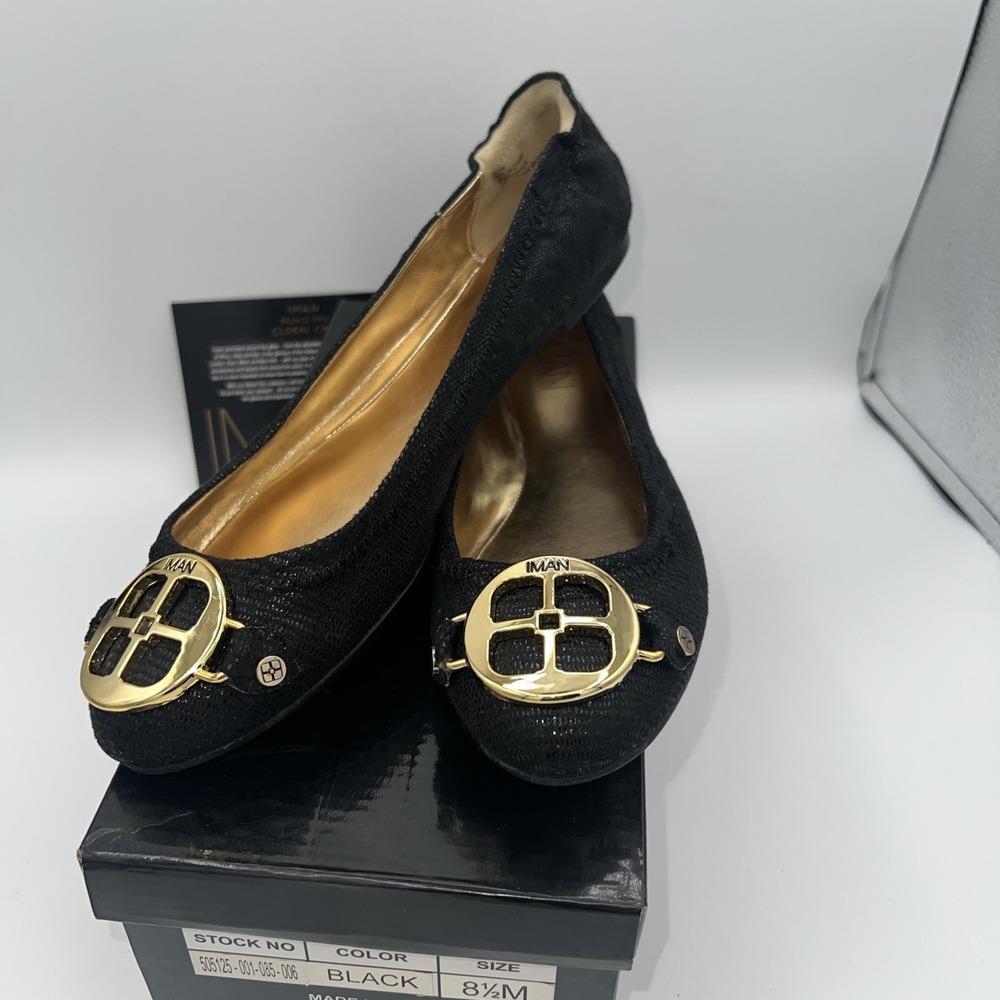 New in box Iman Black Patent Flats Global Chic 8.5 M Signature Gold Logo
